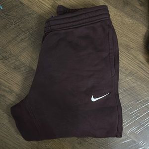 Maroon cuffed Nike sweats